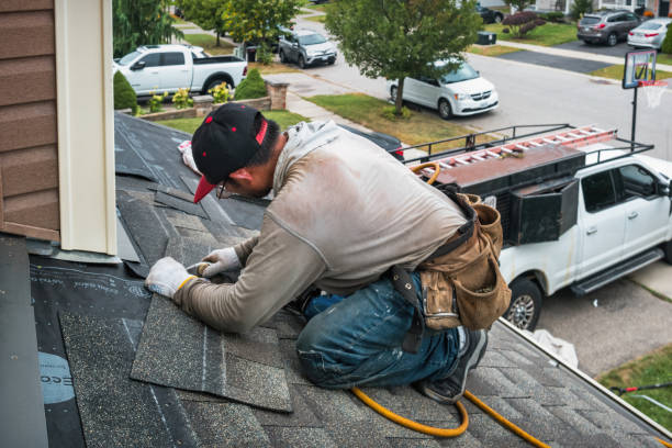 Professional Roof Replacement technician working in Hewlett, NY